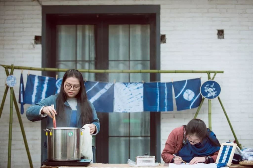 An indigo workshop with textiles drying outdoors.